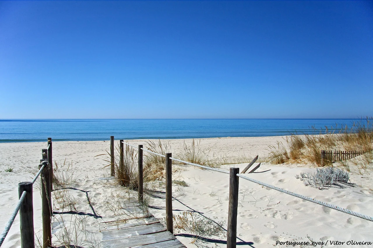 A sandy beach and blue sea along the coast between Cacela Velha and Manta Rota